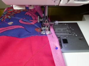 binding a quilt edge with a sewing machine