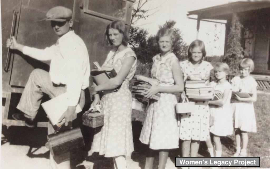 My dad and his sisters as they prepare to board the school bus. Kosciusko County, Indiana, circa 1930