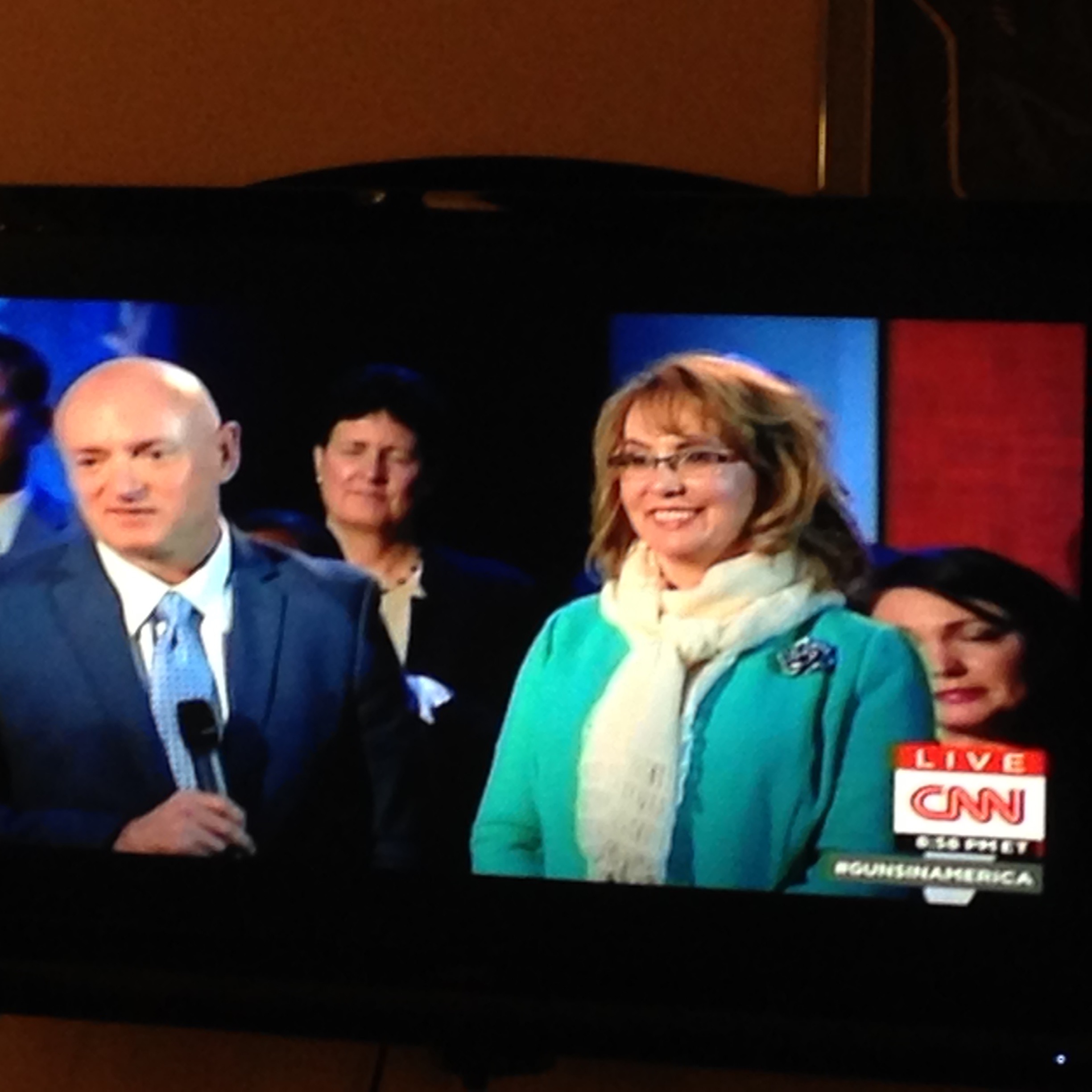 TV screen capture of Gabrielle Giffords and Mark Kelly at CNN sponsored President Obama town hall on Guns