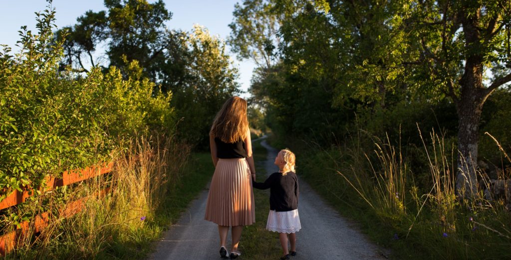 Mom and daughter walking by Jon Ottosson