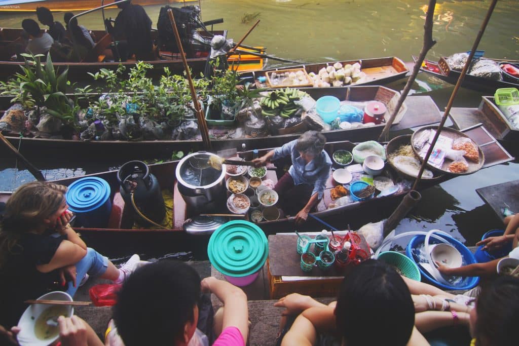 Asian floating market by Harvey Enrile
