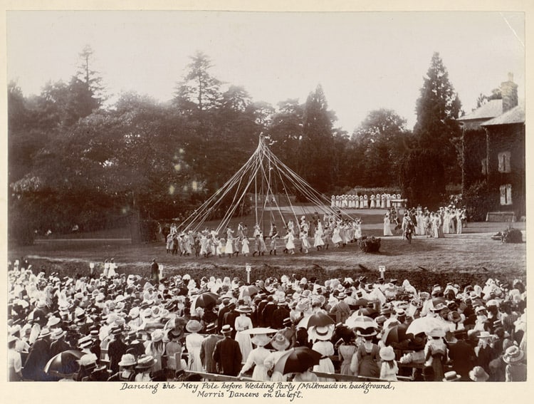 Dancing_the_May_Pole_before_Wedding_Party_-_Milkmaids_in_background,_Morris_Dancers_on_left_(4541056352)