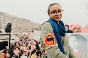 Young woman at Women's March January 2017. Photo by roya-ann-miller on unsplash.com