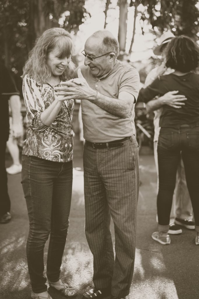 Older couple dancing in Golden Gate Park Sanfrancisco.  
