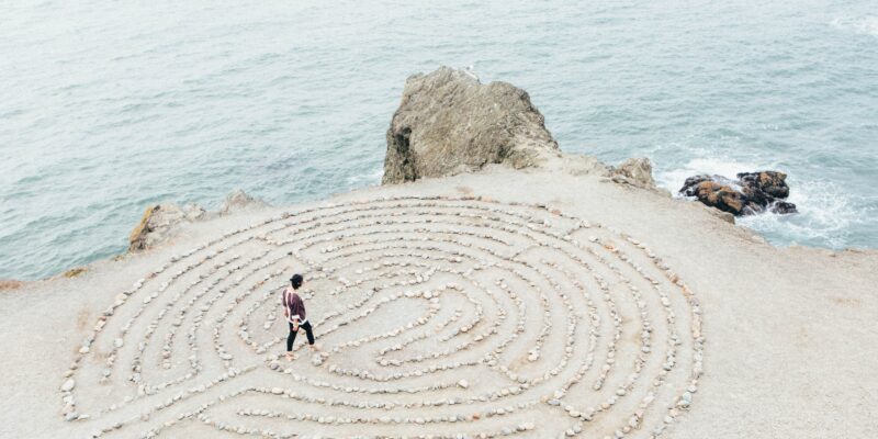 labyrinth on the beach by Ashley Batz on Unsplash.